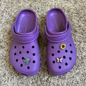 Purple Crocs with charms